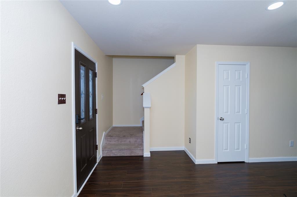 1717 Shawnee Trail Allen, TX 75002 - Photo 12 of 35 a view of a hallway with wooden floor