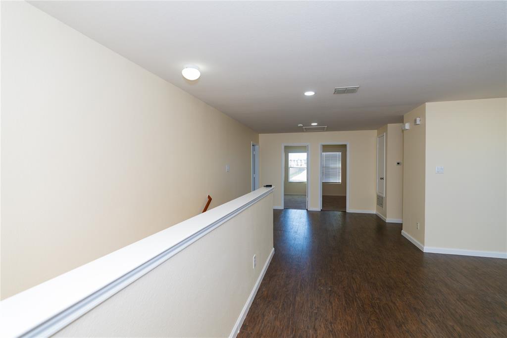 1717 Shawnee Trail Allen, TX 75002 - Photo 23 of 35 a view of an empty room with wooden floor
