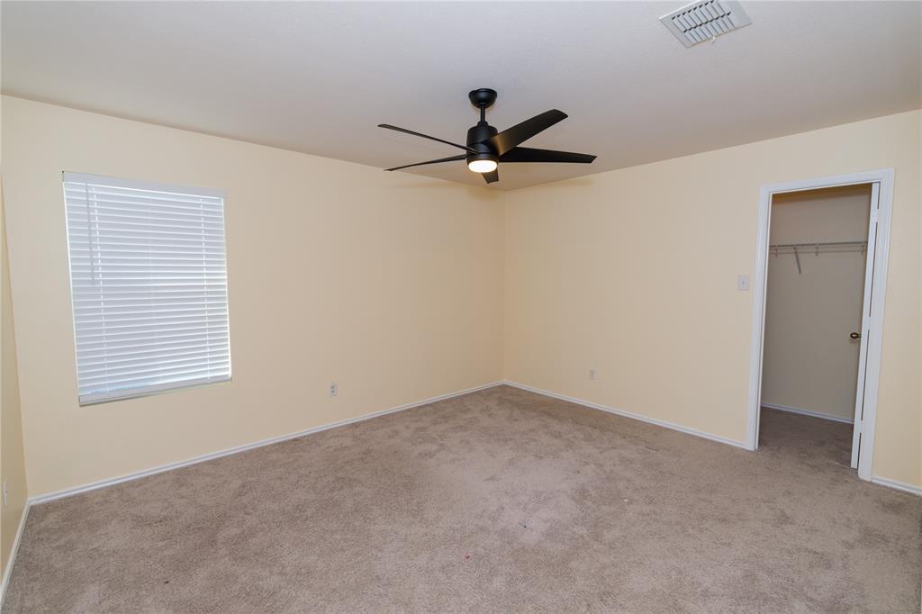 1717 Shawnee Trail Allen, TX 75002 - Photo 24 of 35 an empty room with a window and a fan