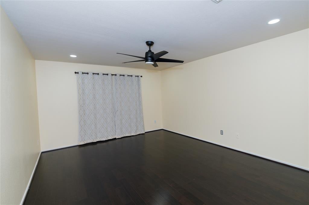 1717 Shawnee Trail Allen, TX 75002 - Photo 6 of 35 wooden floor in an empty room with a window