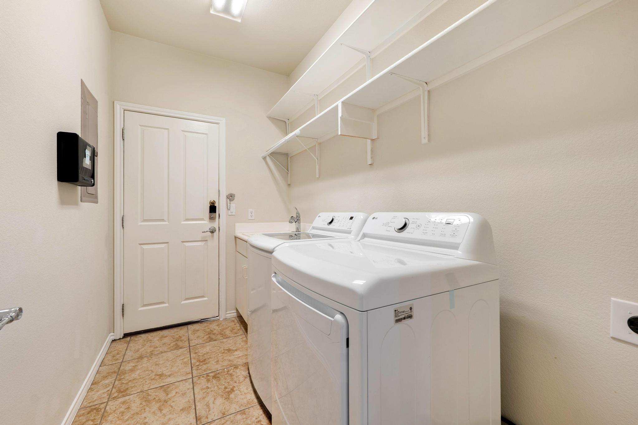 520 Mill Pond Path Georgetown, TX 78633 - Photo 37 of 38 Functional utility room with ample storage and durable tile flooring for everyday convenience.