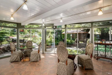 a dining room with furniture and window
