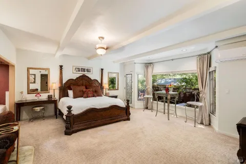 a backyard of a house with yard and outdoor seating