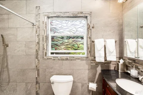 a view of a kitchen with a sink and a large window