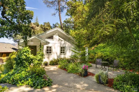 a white toilet sitting next to a bathroom sink