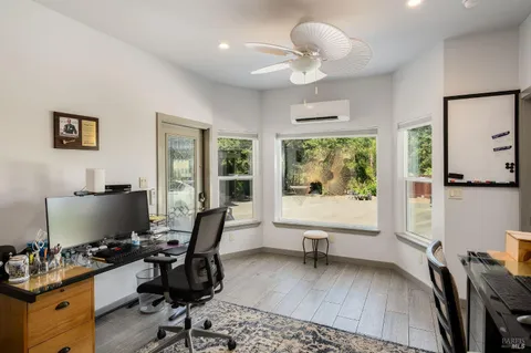 a bathroom with a granite countertop sink a bathtub and shower