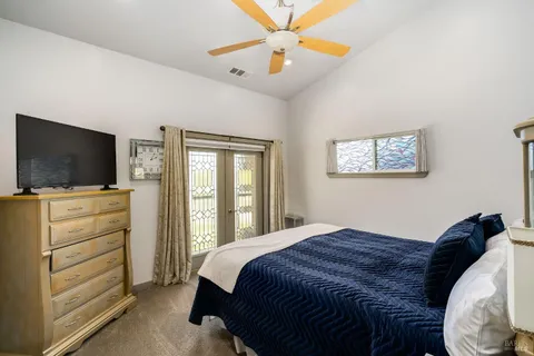 a living room with furniture large window and a flat screen tv