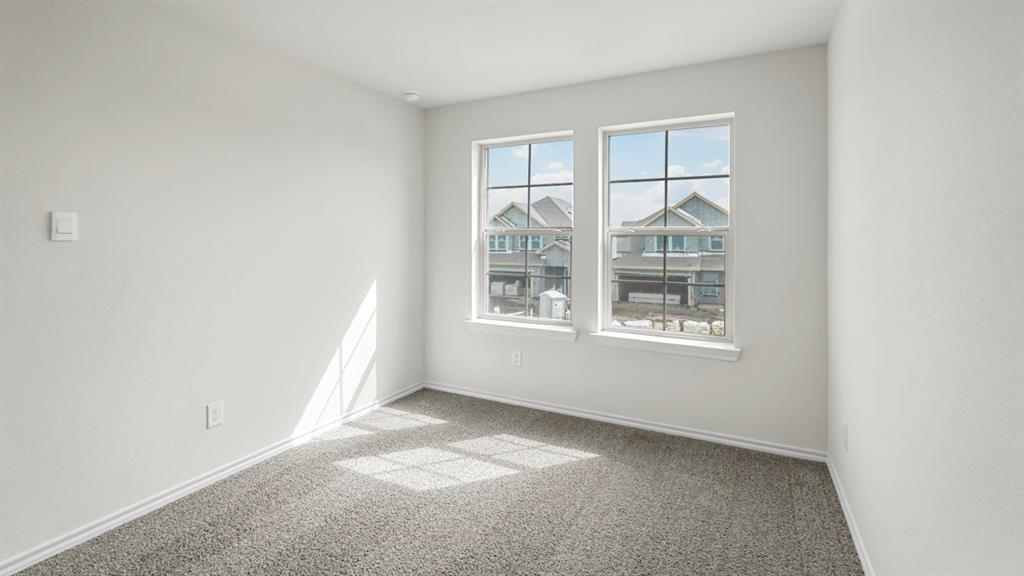 216 Pheasant Run Road Terrell, TX 75160 - Photo 18 of 37 Recessed lighting illuminates a room featuring a textured wall finish and a neutral carpet