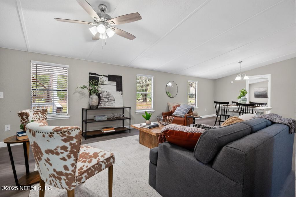 95422 Plum Loop Fernandina Beach, FL 32034 - Photo 12 of 76 a living room with furniture and a flat screen tv