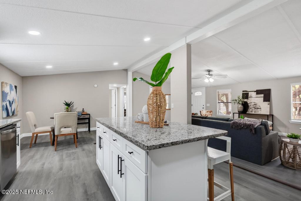 95422 Plum Loop Fernandina Beach, FL 32034 - Photo 25 of 76 a living room with granite countertop kitchen island furniture and a wooden floor