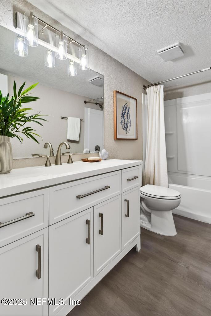 95422 Plum Loop Fernandina Beach, FL 32034 - Photo 42 of 76 a bathroom with a double vanity sink a toilet and a mirror