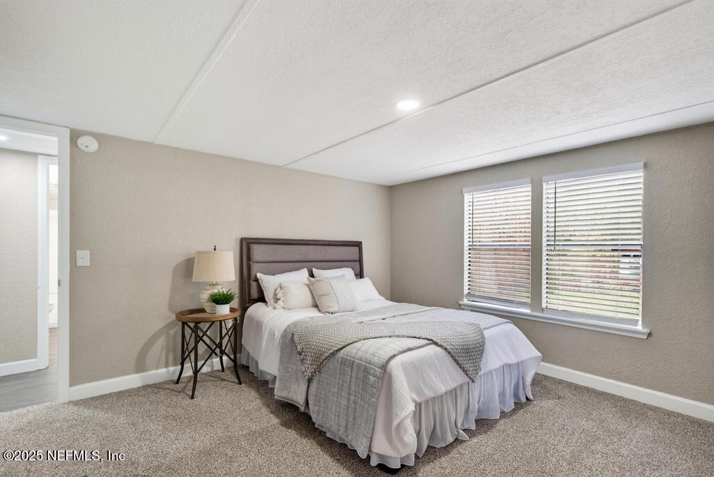95422 Plum Loop Fernandina Beach, FL 32034 - Photo 45 of 76 a bedroom with a bed and a window