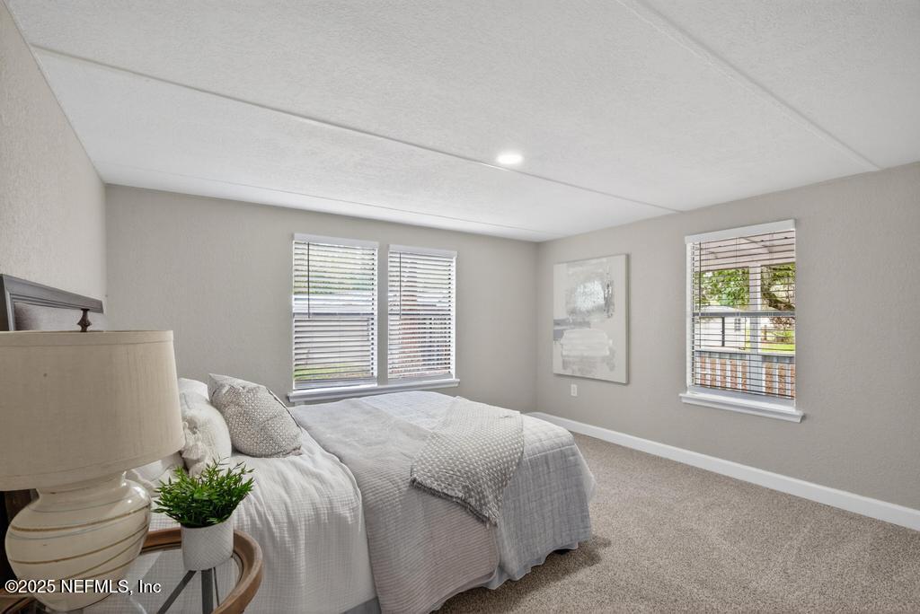 95422 Plum Loop Fernandina Beach, FL 32034 - Photo 46 of 76 a bedroom with a bed and a window