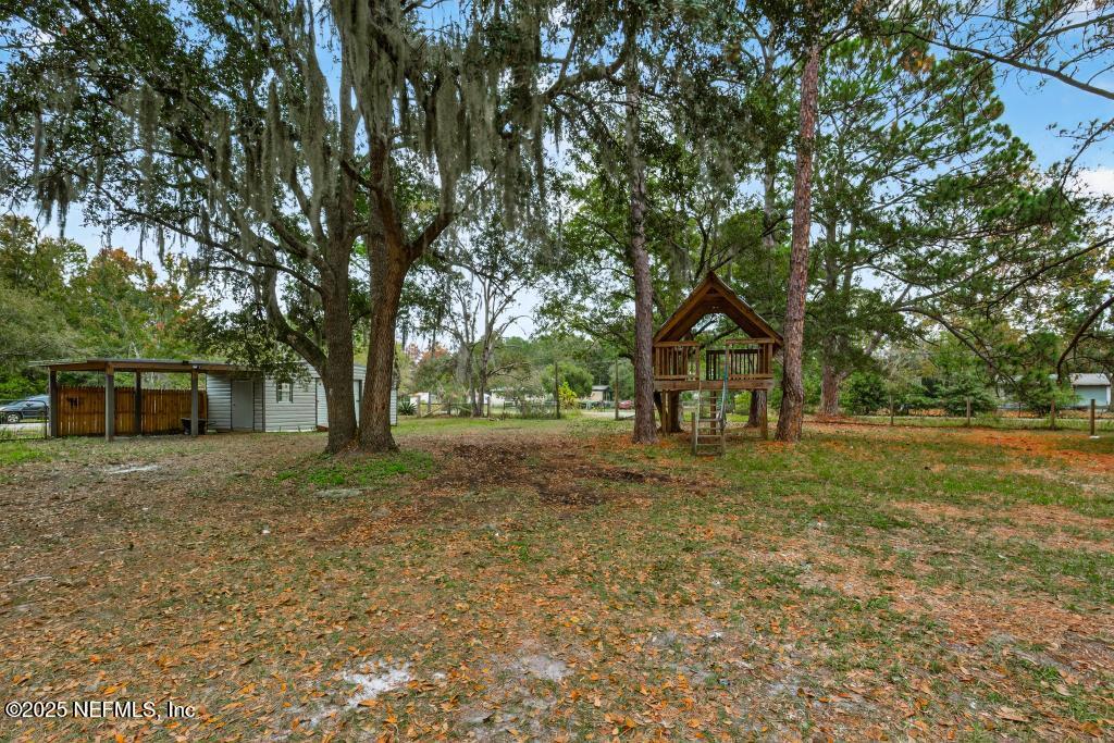 95422 Plum Loop Fernandina Beach, FL 32034 - Photo 59 of 76 a view of a house with yard and tree s