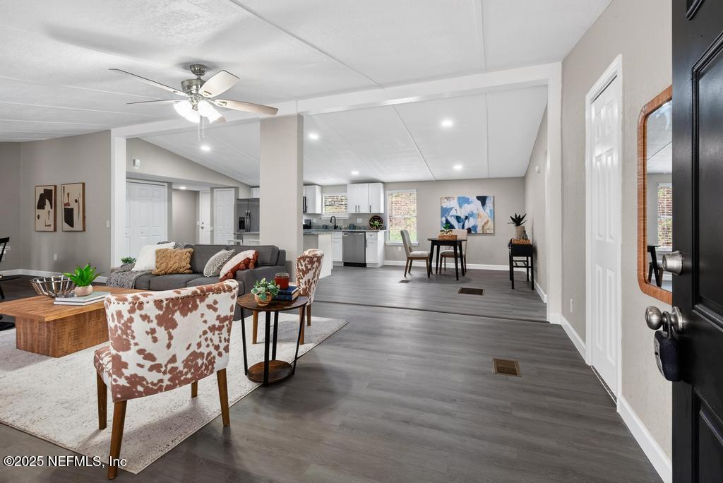 95422 Plum Loop Fernandina Beach, FL 32034 - Photo 9 of 76 a living room with furniture kitchen view and a wooden floor