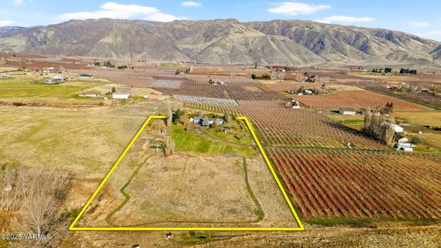 an aerial view of residential building and ocean