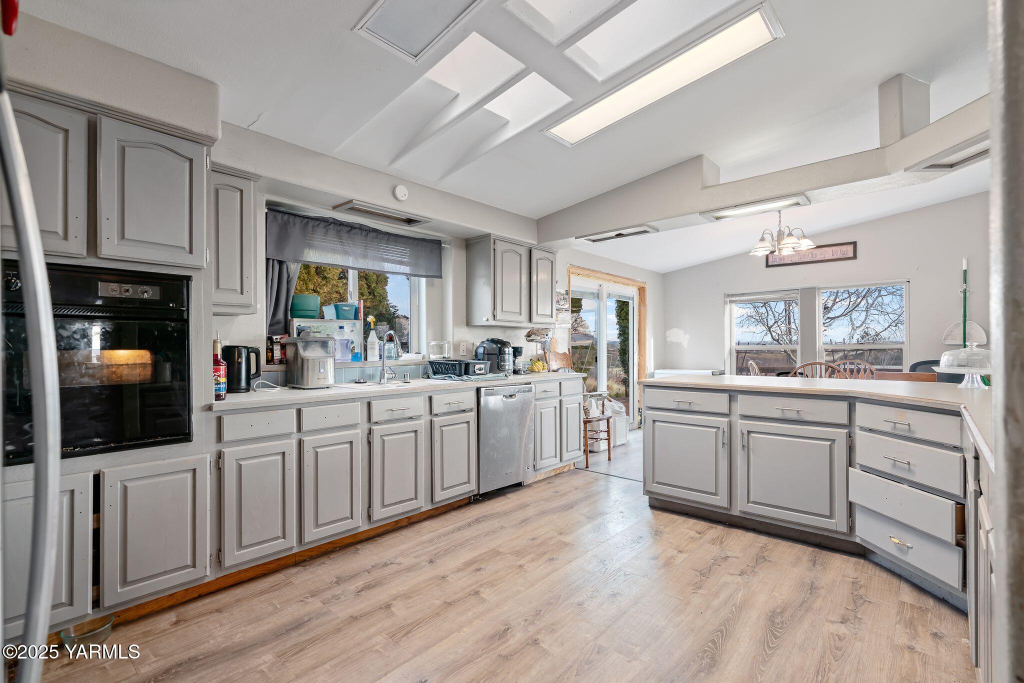 1880 Franklin Road Tieton, WA 98947 - Photo 6 of 29 a kitchen with white cabinets and sink