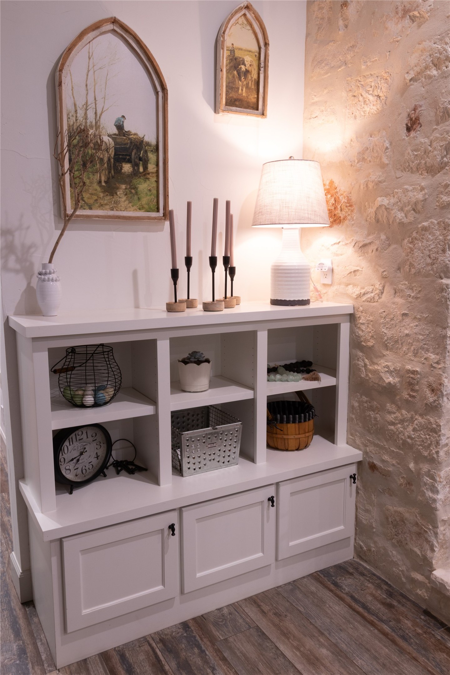 272 Slate Rock Road Fredericksburg, TX 78624 - Photo 23 of 32 Built-in shelving on both sides and cabinet storage flank the main Texas limestone fireplace with German Schmear on both sides