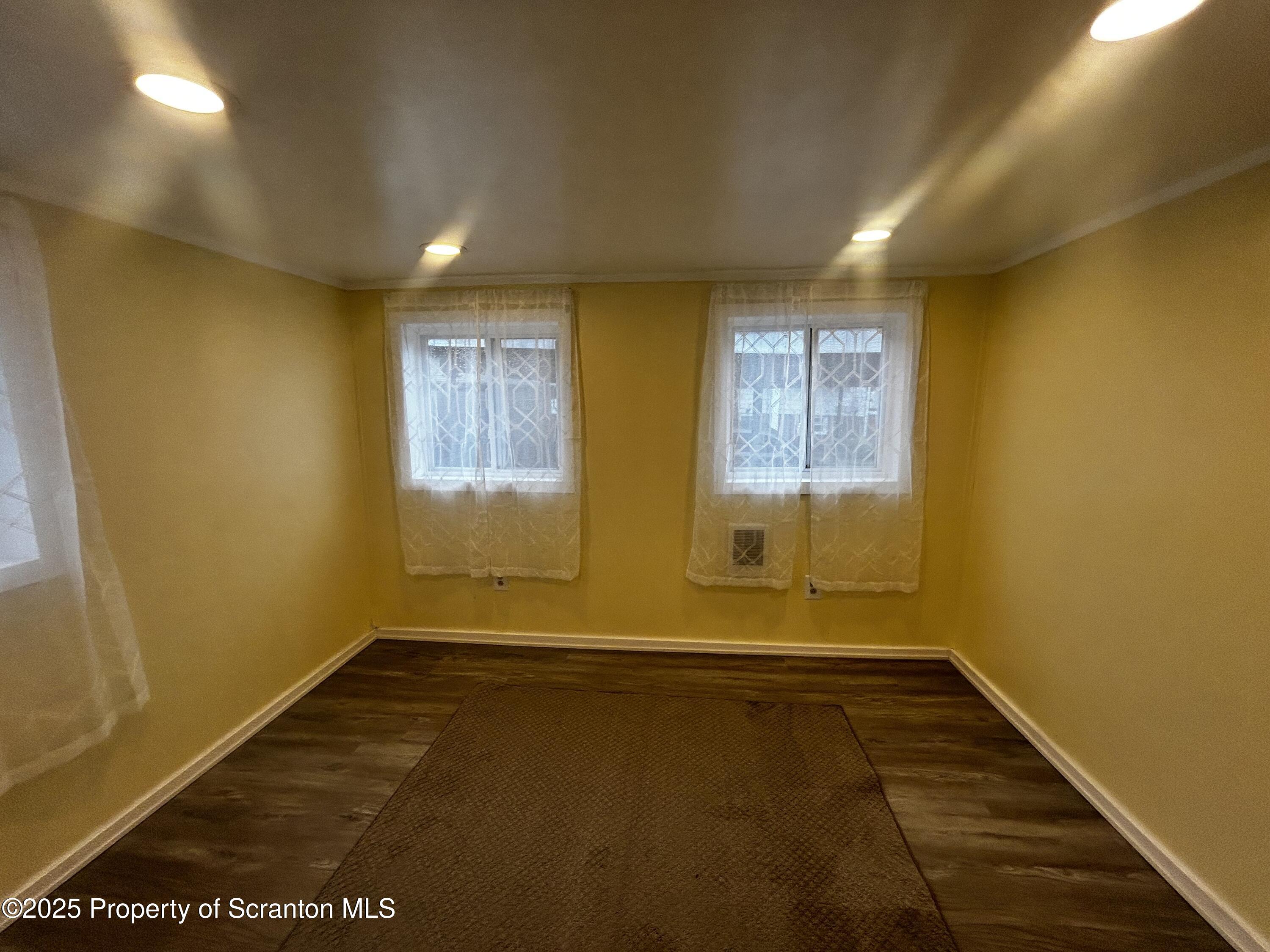 1214 Mine Street Old Forge, PA 18518 - Photo 13 of 21 en empty room with windows