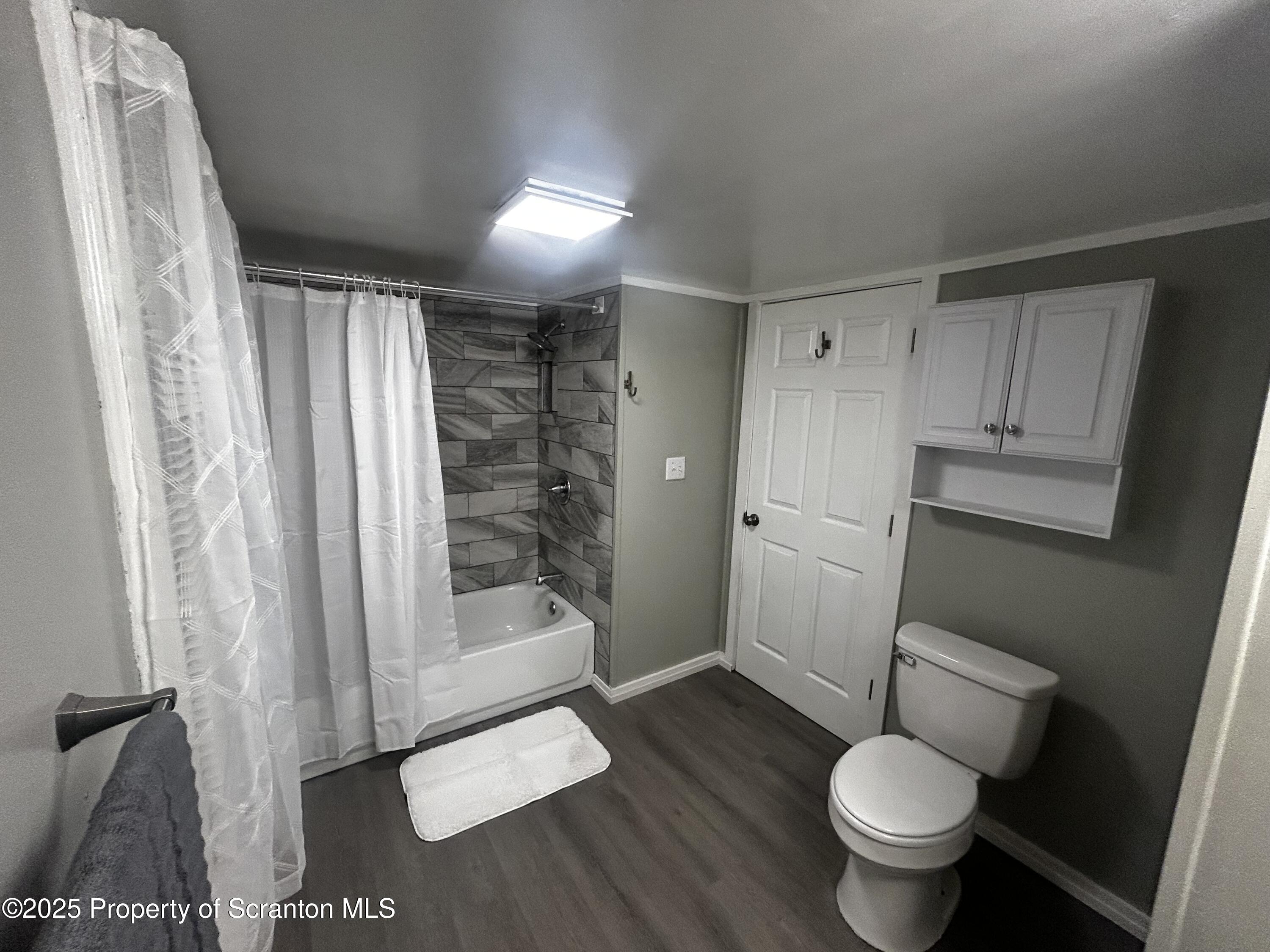 1214 Mine Street Old Forge, PA 18518 - Photo 16 of 21 a bathroom with a sink toilet and shower