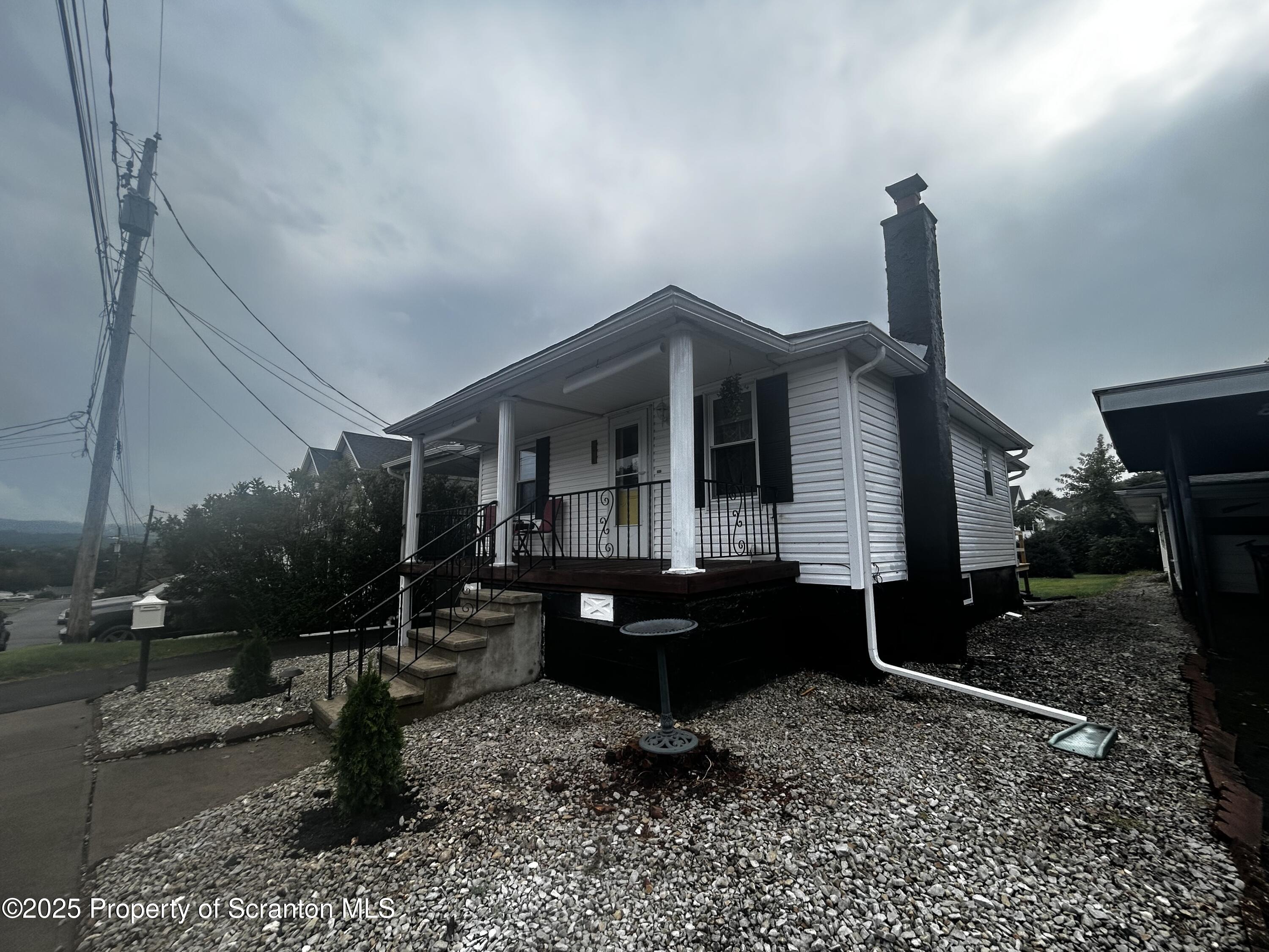 1214 Mine Street Old Forge, PA 18518 - Photo 3 of 21 a front view of a house with garden