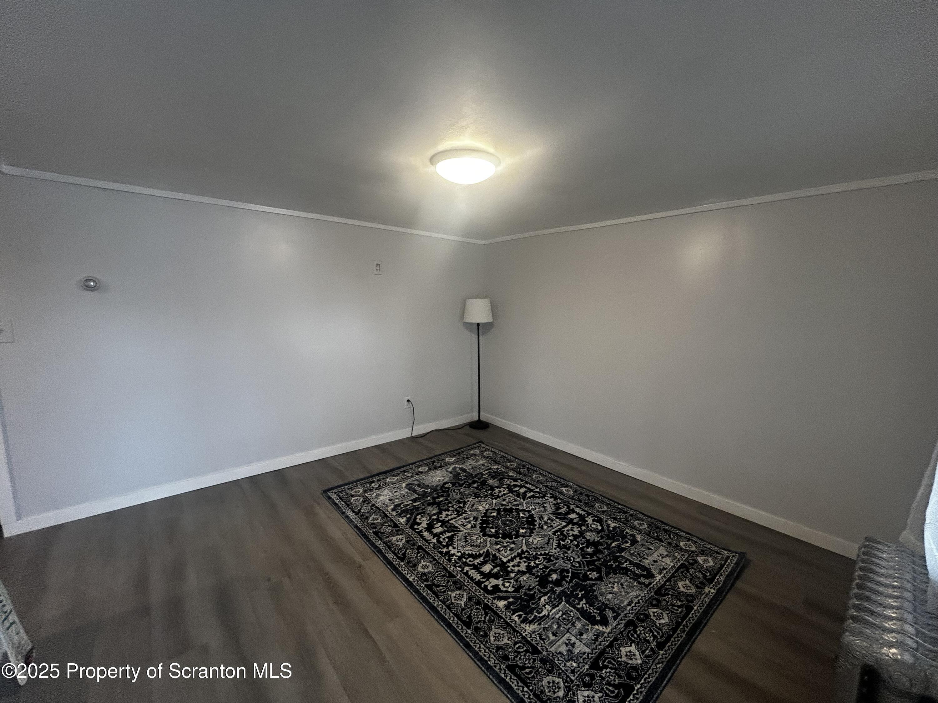 1214 Mine Street Old Forge, PA 18518 - Photo 10 of 21 an empty room with a rug