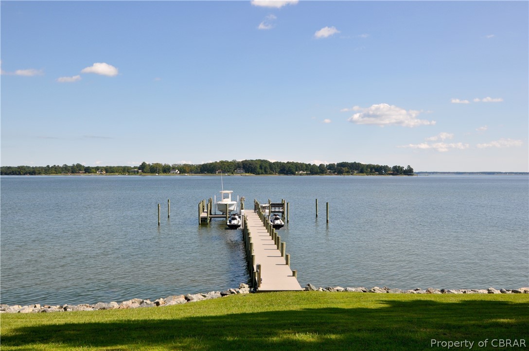 1000 Queenstown Road Lancaster, VA 22503 - Photo 22 of 49 a view of a lake with houses in the background