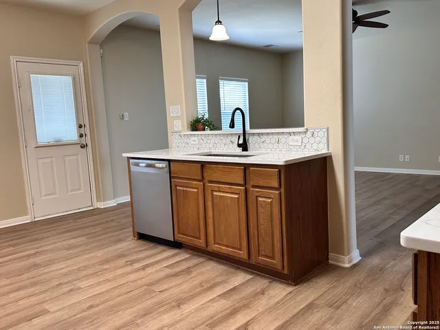 a kitchen with a stove and a sink
