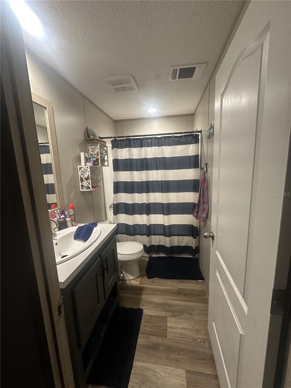 42833 Cooter Pond Road DeLand, FL 32720 - Photo 13 of 16 a kitchen with a sink and refrigerator