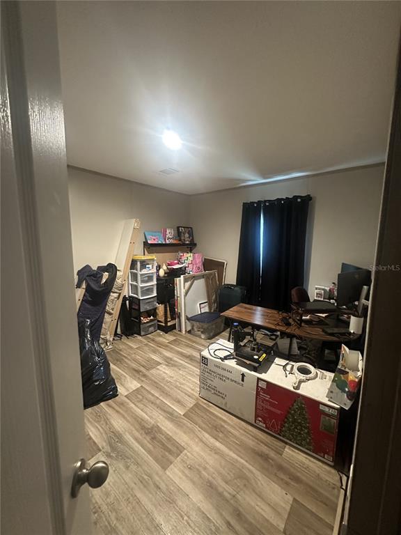 42833 Cooter Pond Road DeLand, FL 32720 - Photo 14 of 16 a room with furniture a flat screen tv and a window