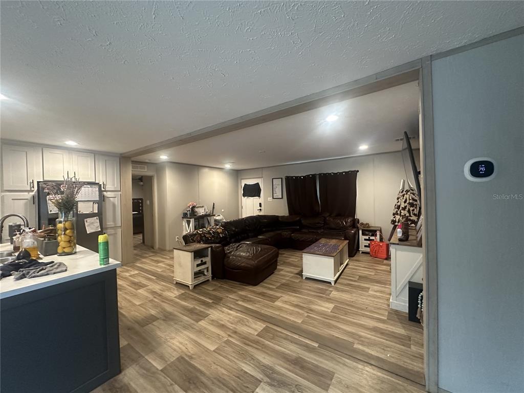 42833 Cooter Pond Road DeLand, FL 32720 - Photo 7 of 16 a living room with furniture and a wooden floor