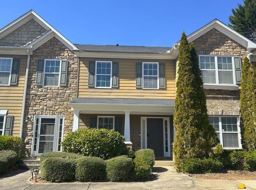front view of a house with a yard