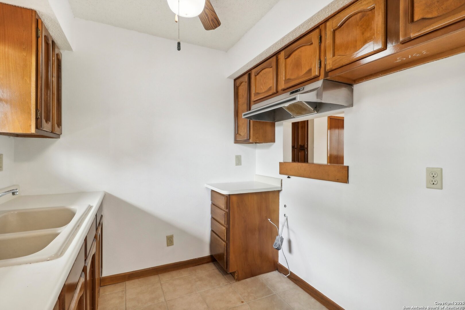 1551 Pebble Beach Road Lakehills, TX 78063 - Photo 19 of 46 a view of a kitchen with a sink