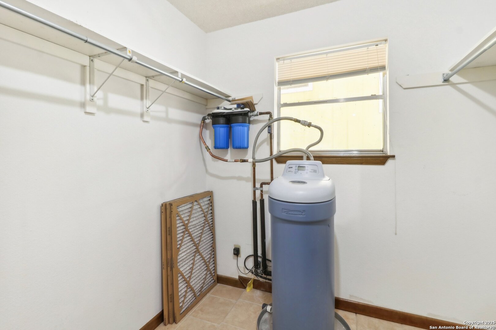 1551 Pebble Beach Road Lakehills, TX 78063 - Photo 32 of 46 a view of storage and utility room with racks on the wall