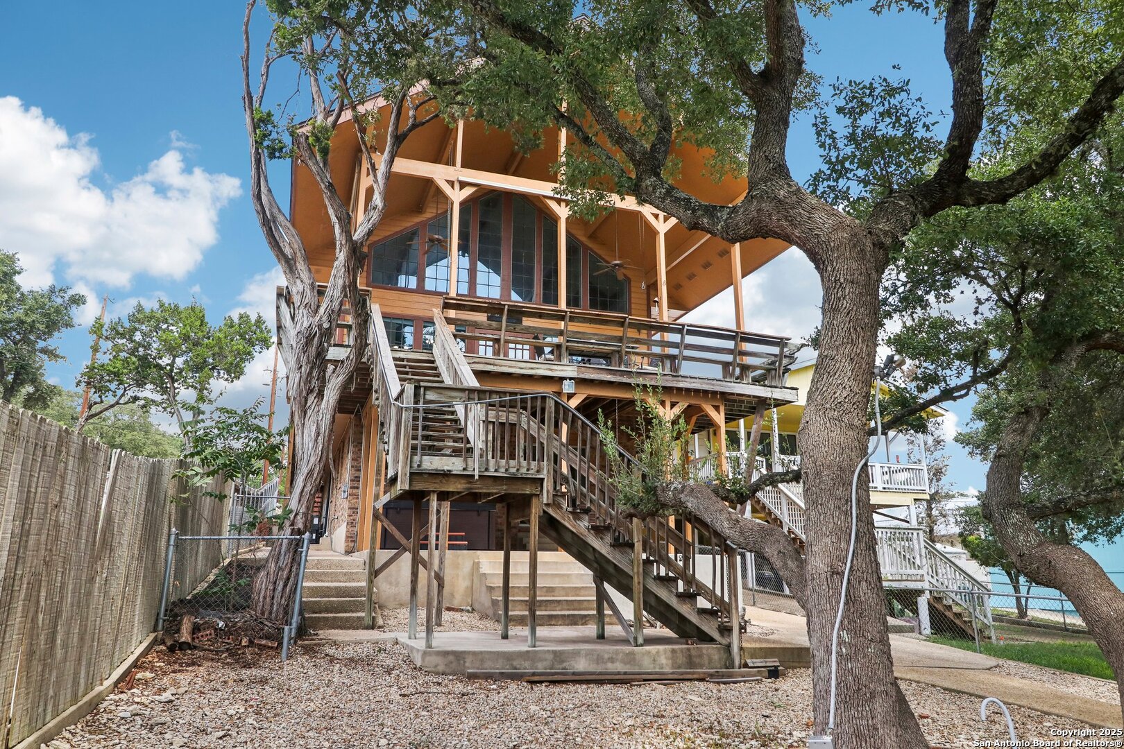 1551 Pebble Beach Road Lakehills, TX 78063 - Photo 40 of 46 a view of a house with large trees