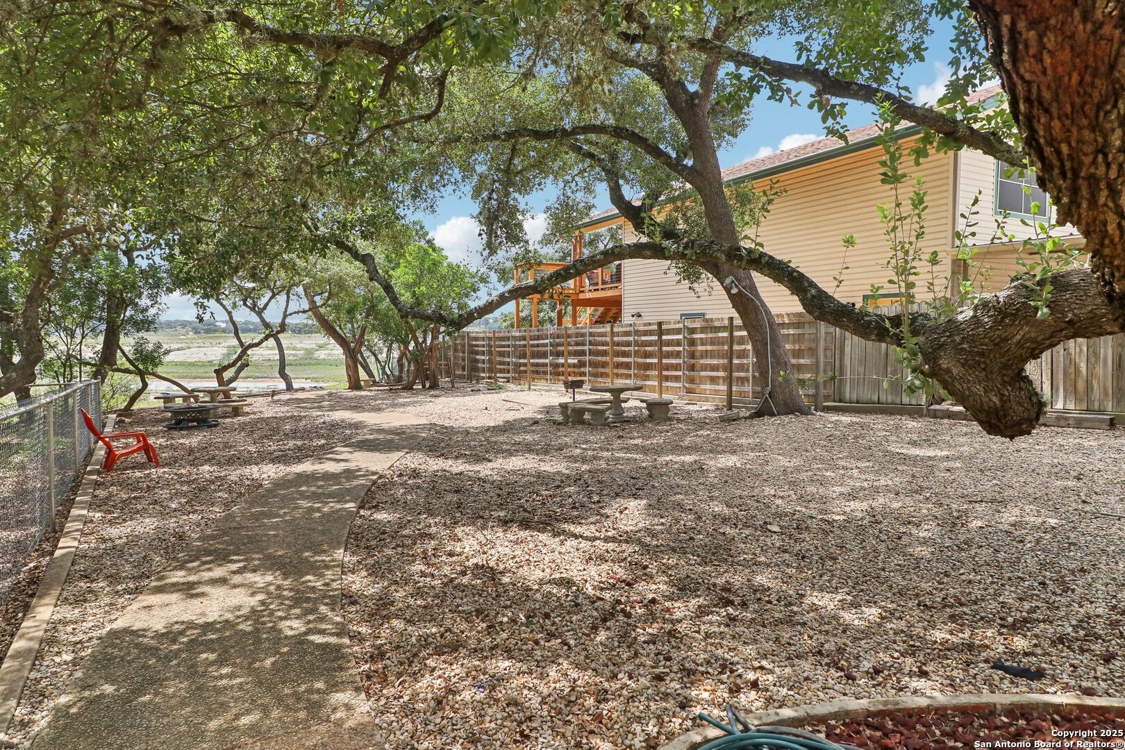 1551 Pebble Beach Road Lakehills, TX 78063 - Photo 41 of 46 a view of a house with a yard