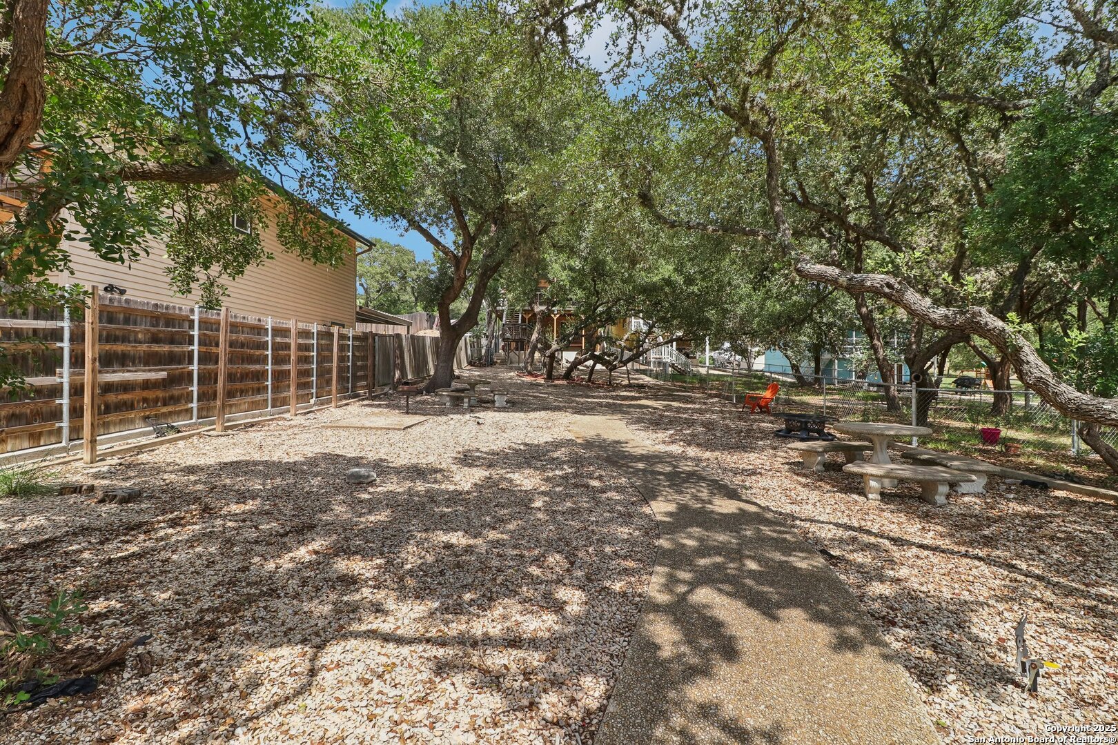 1551 Pebble Beach Road Lakehills, TX 78063 - Photo 45 of 46 a backyard of a house with lots of green space