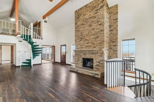 a view of a livingroom with furniture and a fireplace