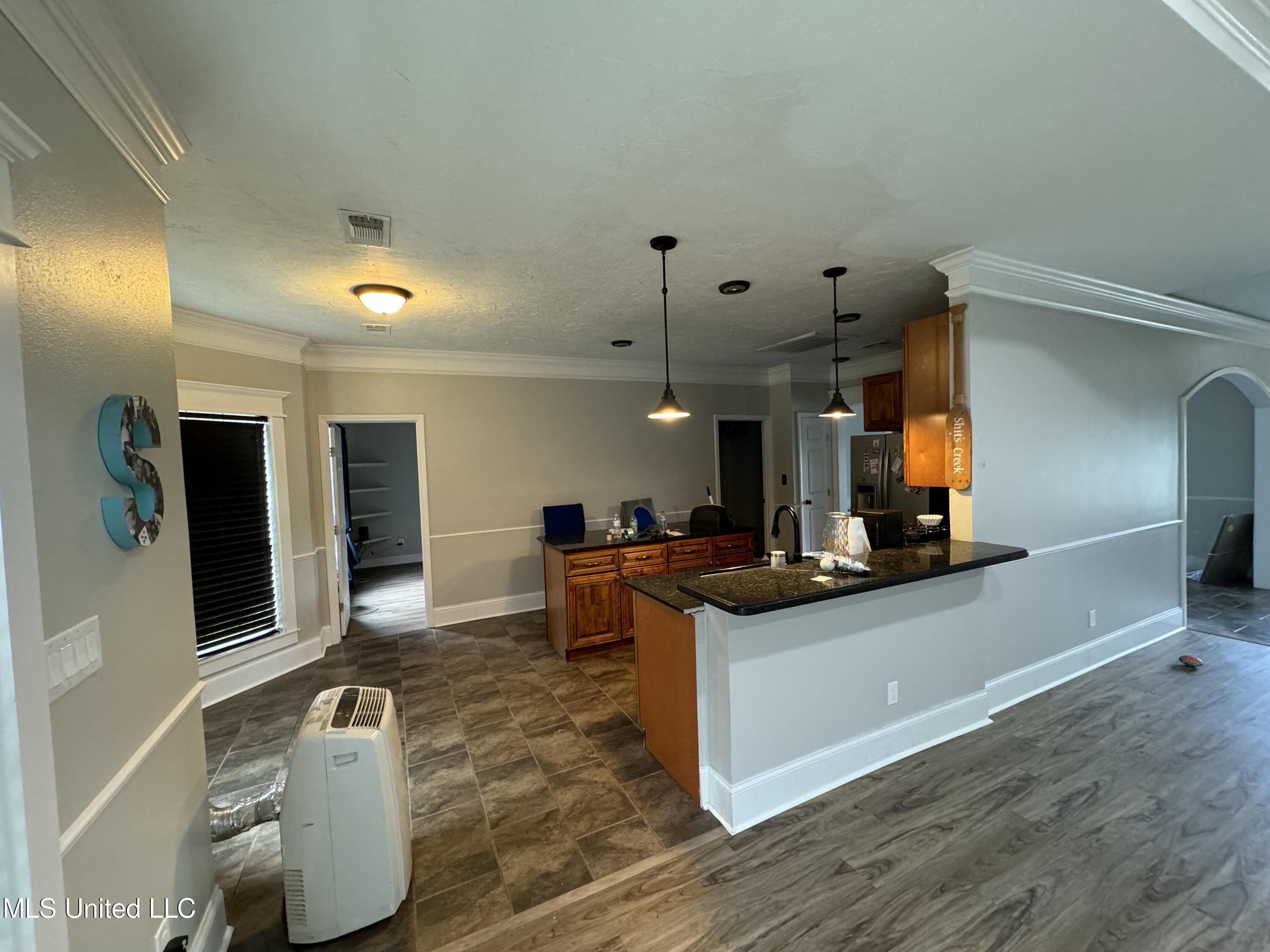 318 West McHenry Road Perkinston, MS 39573 - Photo 6 of 17 318 W - Kitchen from living room
