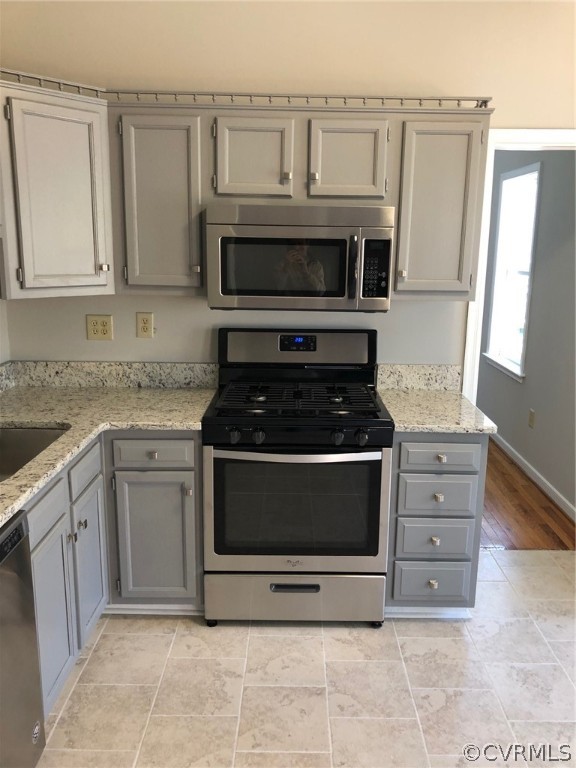 3218 Ludgate Road Chester, VA 23831 - Photo 5 of 34 a kitchen with granite countertop white cabinets and stainless steel appliances