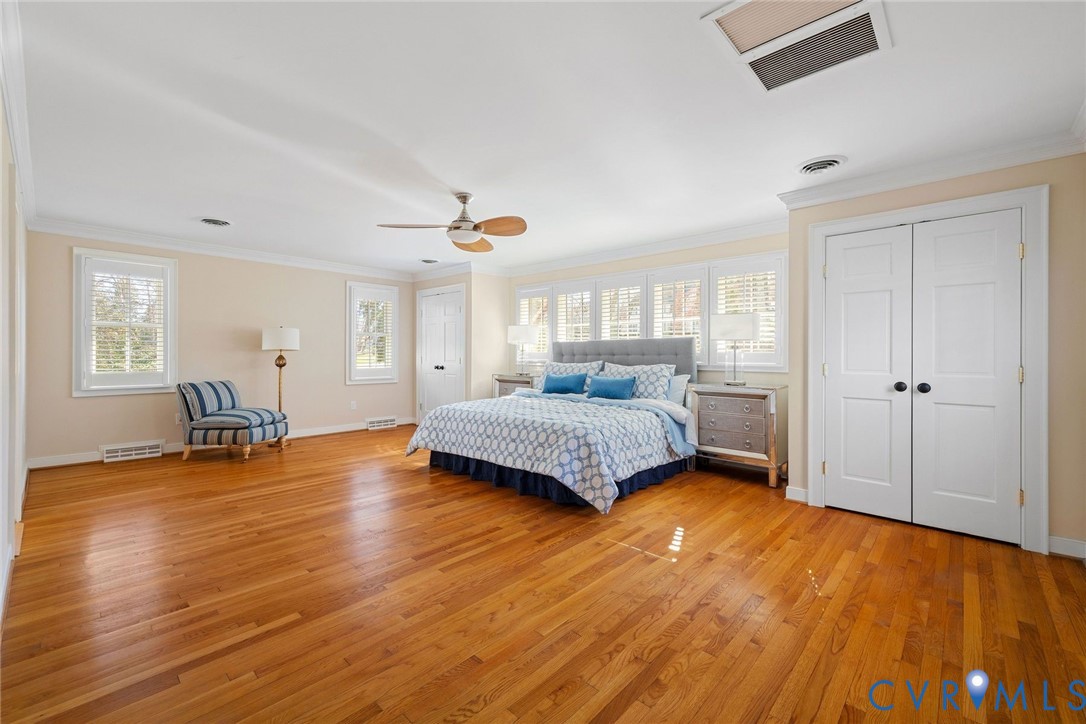 9804 Kingsbridge Road Henrico, VA 23238 - Photo 25 of 50 a bedroom with a bed and wooden floor