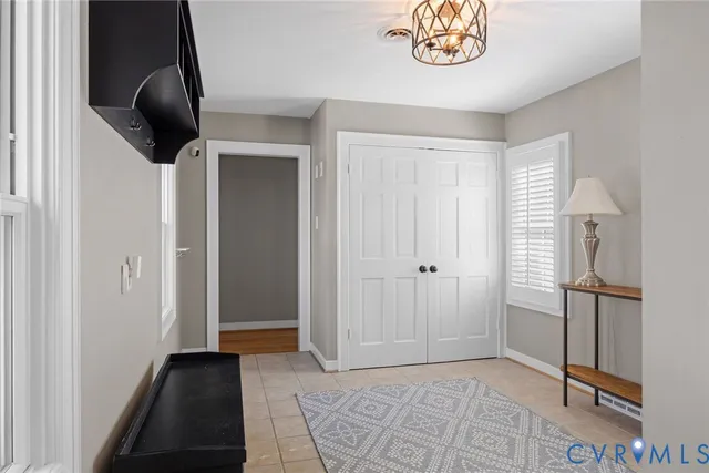 a view of an entryway with a carpet