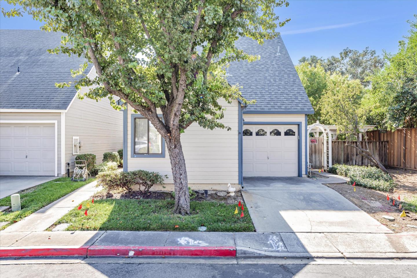 720 Natalie Drive Morgan Hill, CA 95037 - Photo 1 of 35 a front view of a house with a yard and potted plants