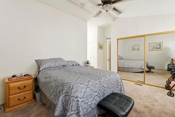 a bedroom with a bed and a dresser