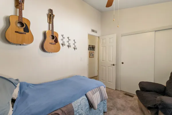 a bedroom with a bed and couch