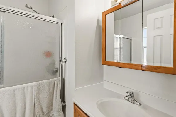 a bathroom with a sink and a mirror