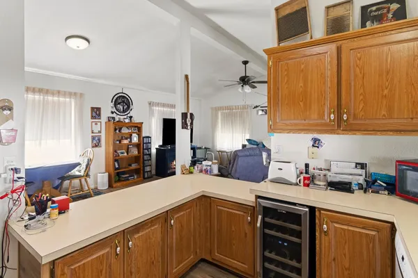 a kitchen with a sink dishwasher stove and cabinets