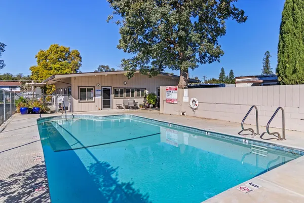 a view of a swimming pool with a patio