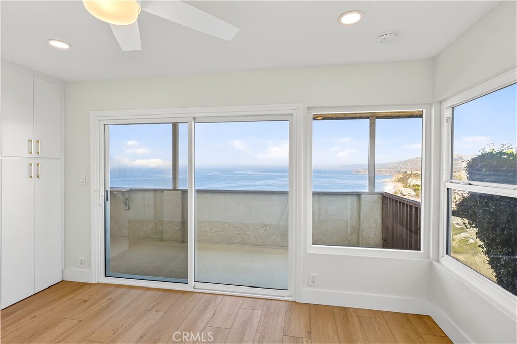 34381 Dana Strand Road, Unit 2 Dana Point, CA 92629 - Photo 23 of 42 wooden floor in an empty room with a window