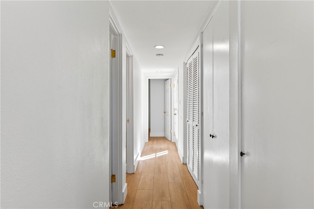 34381 Dana Strand Road, Unit 2 Dana Point, CA 92629 - Photo 24 of 42 a view of a hallway with wooden floor